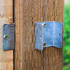 Carbon steel fence clip fixed to fence post