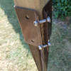 Close up of support spike bolted around a fence post