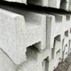 Stack of slotted concrete fence posts