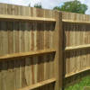Timber square arris rail slotted into fence post supporting featheredge panels
